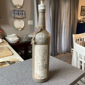 Decorative Tan Bottle with Crown Design